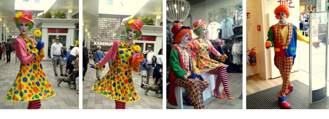 Living Clowns lebende Puppen bei einer Geschäftseröffnung
